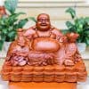 Tượng Di Lặc Ngồi Bê Thỏi Vàng Gỗ Hương Đá Ngang 50